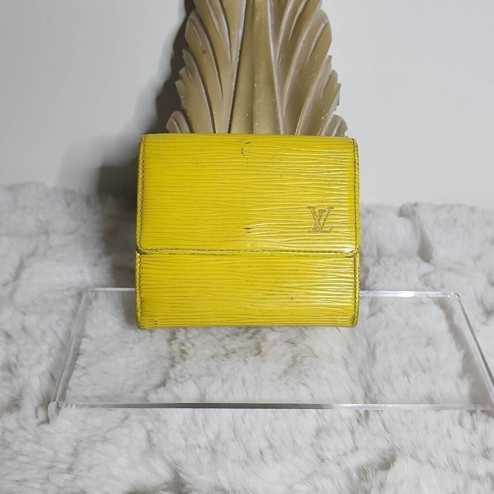 Louis Vuitton Elise Trifold Wallet crafted from their signature Tassil Yellow Ep